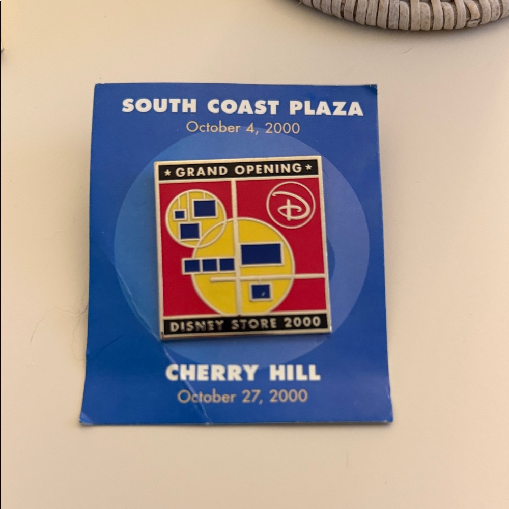 Disney Grand Opening Pin with Red and Yellow Design